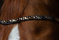 Load image into Gallery viewer, Brauner geschwungener Slim-Stirnriemen Lucky (Nr.107.) mit braun/ goldenen Steinen von der Marke Ascot Reitsportartikel.