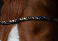 Load image into Gallery viewer, Slim-Stirnriemen Lucky (Nr. 7.) mit braun/ goldenen Strasssteinen von der Marke Ascot Reitsportartikel.