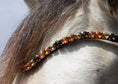 Load image into Gallery viewer, Glitzestirnriemen Majestic (Nr. 9.) mit dicken bernstein/ gold/ aprikotfarbenen Steinen von der Marke Ascot Reitsportartikel.