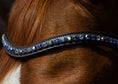 Load image into Gallery viewer, Brauner Lederstirnriemen Shine (Nr.110.) mit eingefassten 110.7 blauen Strasssteinen von der Marke Ascot Reitsportartikel.
